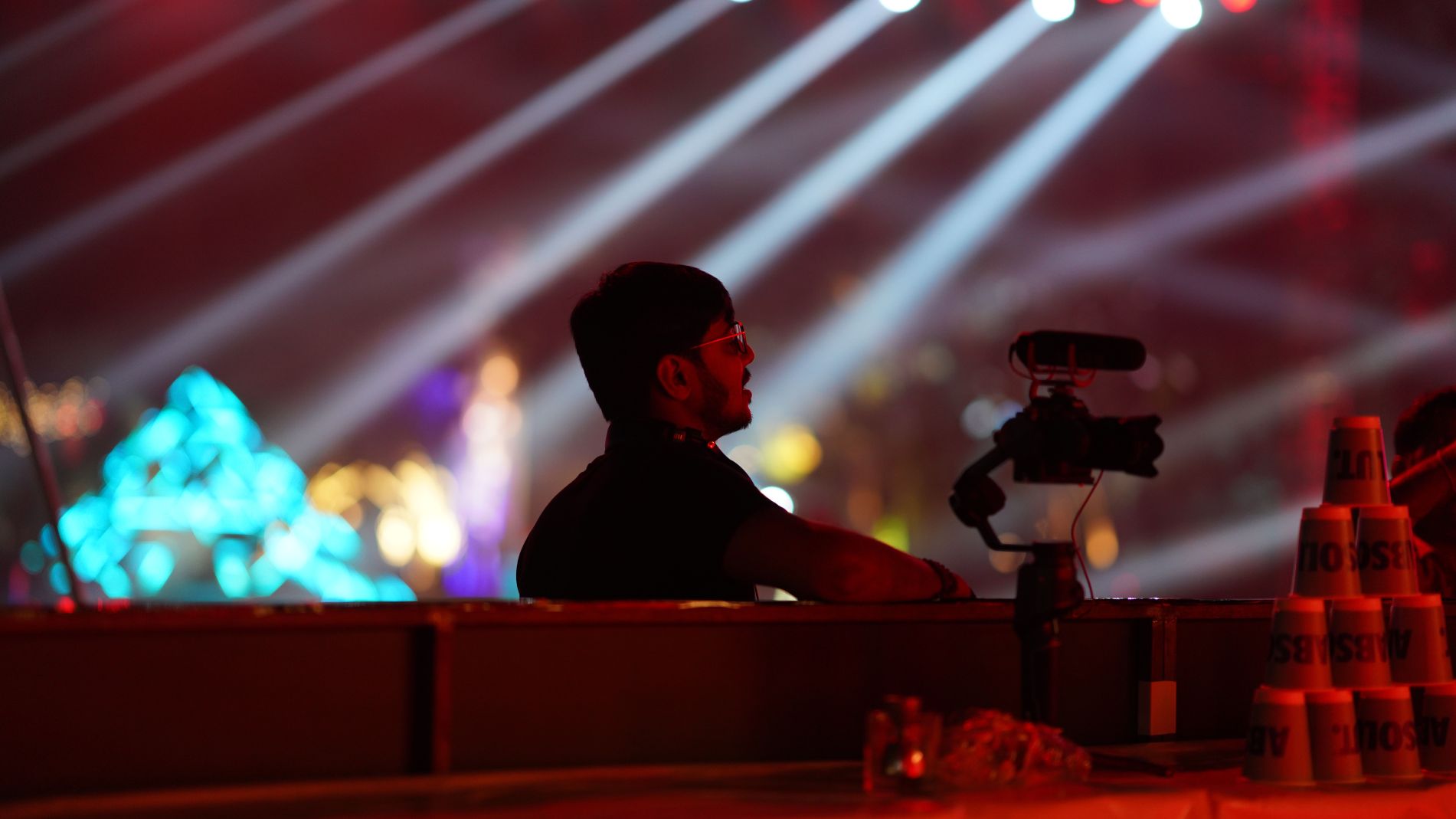 Cinematographer filming with a professional video camera on set