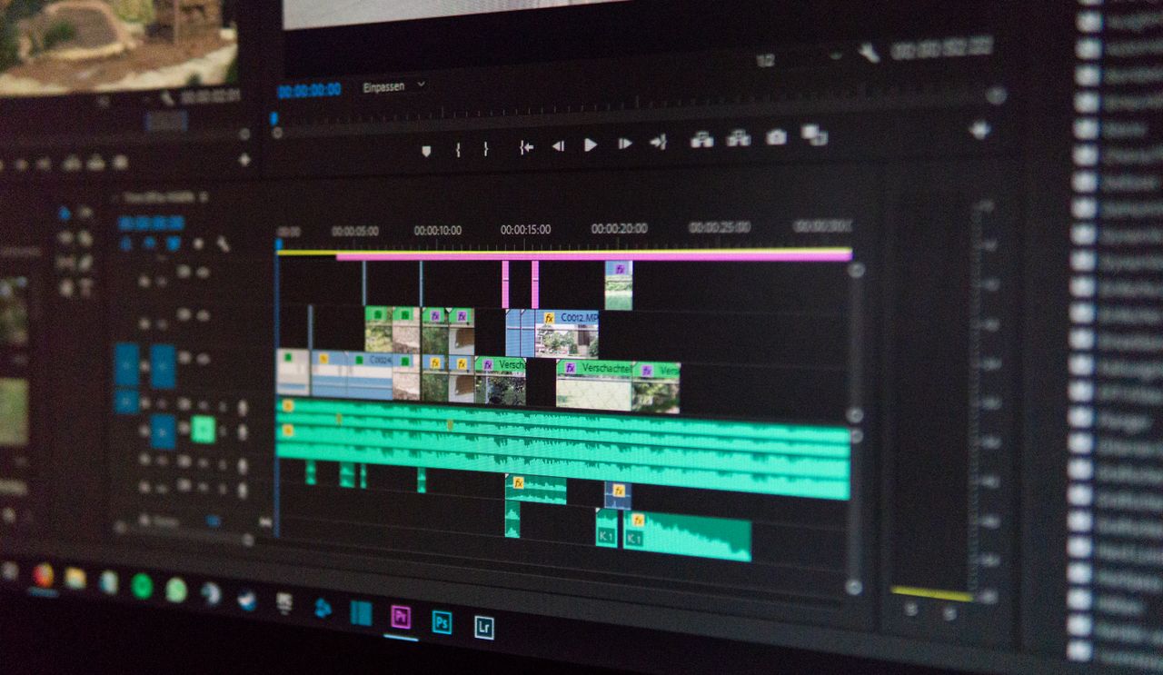 Video editor working on timeline in a dark studio